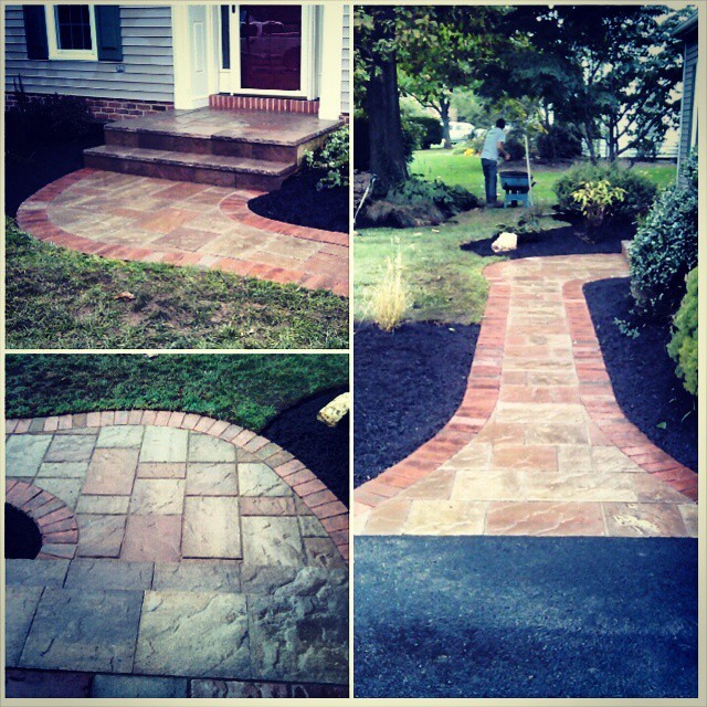 Photo of a rustic partial sun front yard concrete paver landscaping.