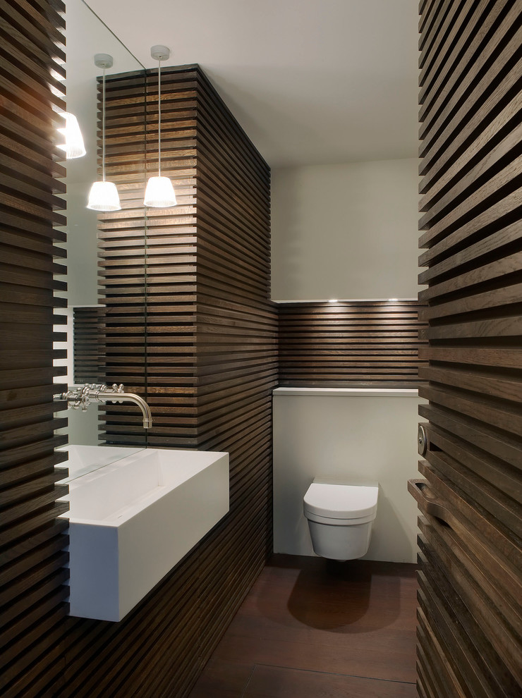 Design ideas for a contemporary powder room in London with a wall-mount sink and a wall-mount toilet.