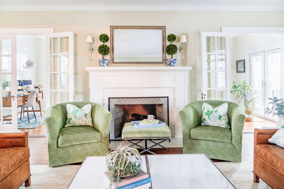 Inspiration for a transitional formal and enclosed medium tone wood floor and brown floor living room remodel in Cincinnati with beige walls, a standard fireplace and a tile fireplace