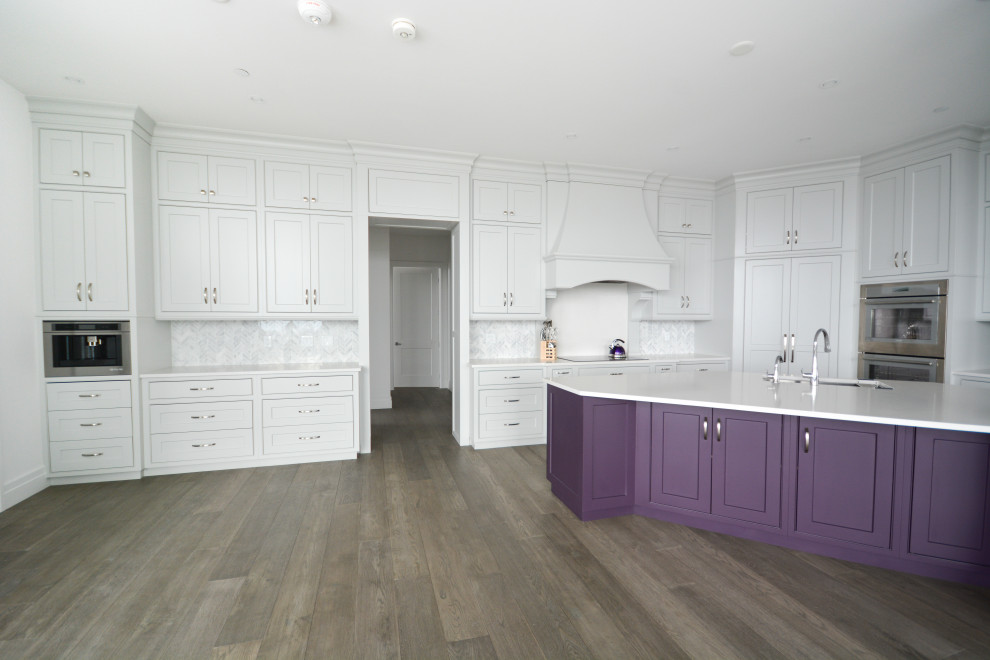 Design ideas for a large transitional open plan kitchen in Toronto with beaded inset cabinets, purple cabinets, quartz benchtops, with island, white benchtop and stainless steel appliances.