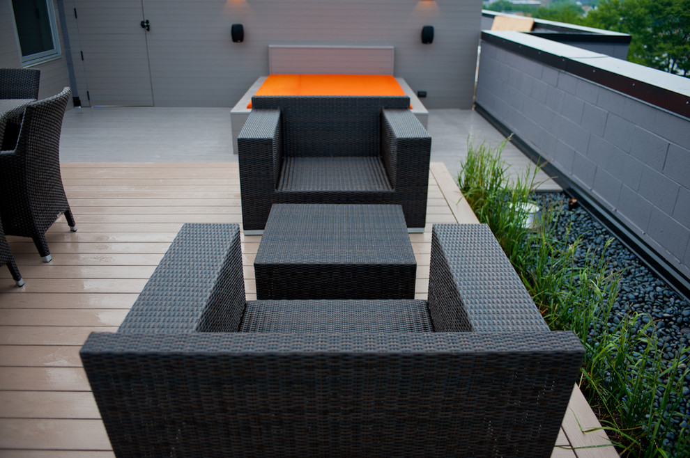 Design ideas for a large modern rooftop deck in Chicago with a fire feature and no cover.