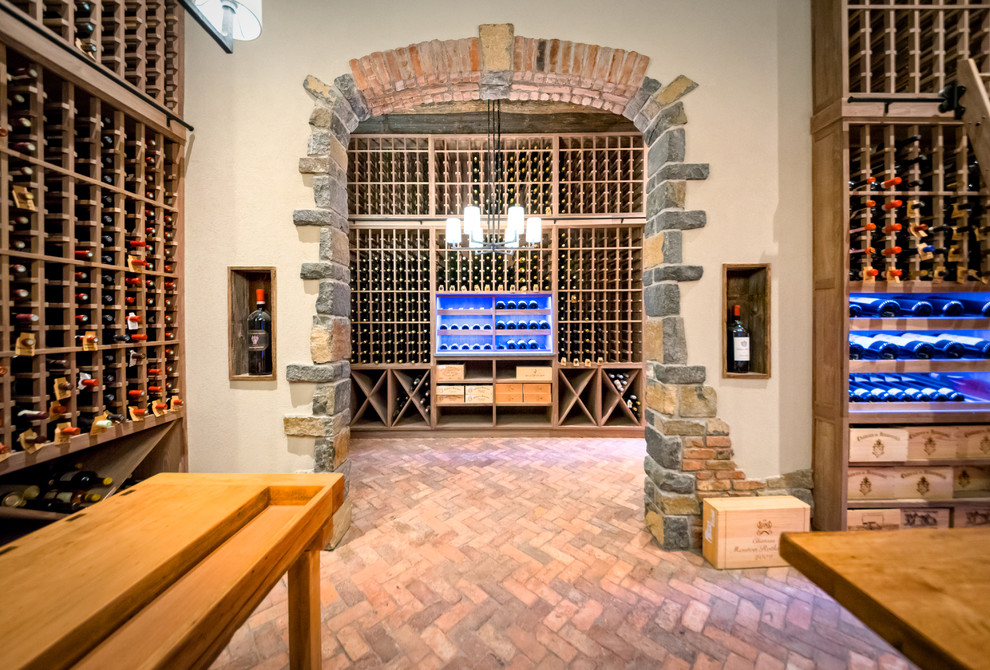 Design ideas for an expansive country wine cellar in New York with brick floors, storage racks and red floor.