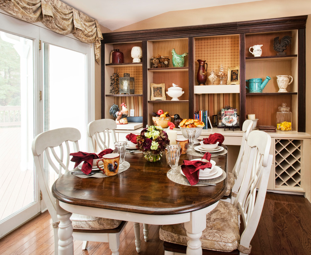 This is an example of a traditional dining room in New York with dark hardwood floors.