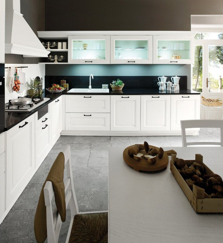 Photo of a large traditional l-shaped separate kitchen in Miami with recessed-panel cabinets, white cabinets, quartz benchtops, black splashback, black appliances, slate floors and grey floor.