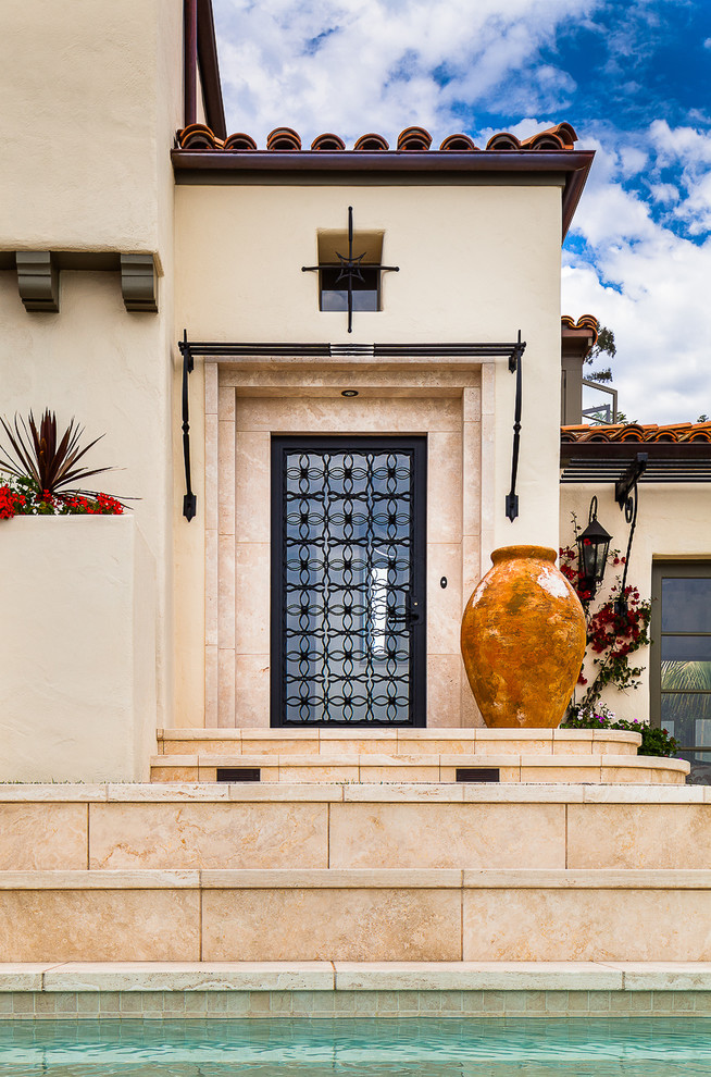 Inspiration for a mediterranean entryway in Santa Barbara with a single front door and a black front door.