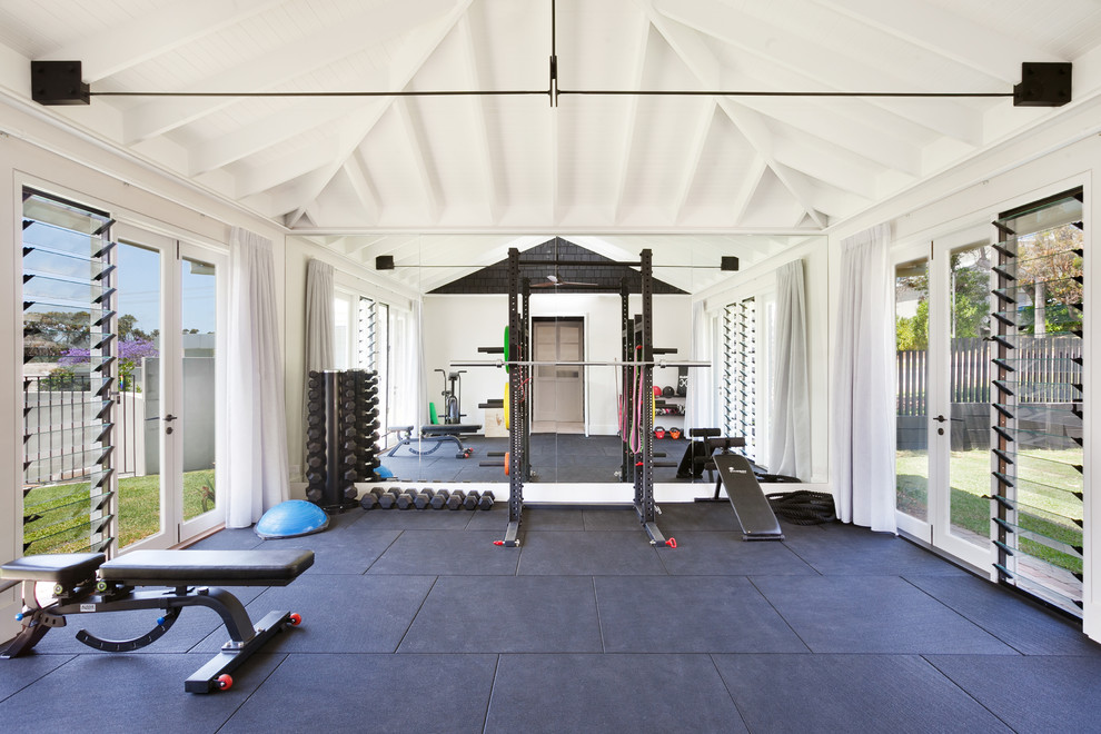 Transitional home gym in Central Coast with white walls.