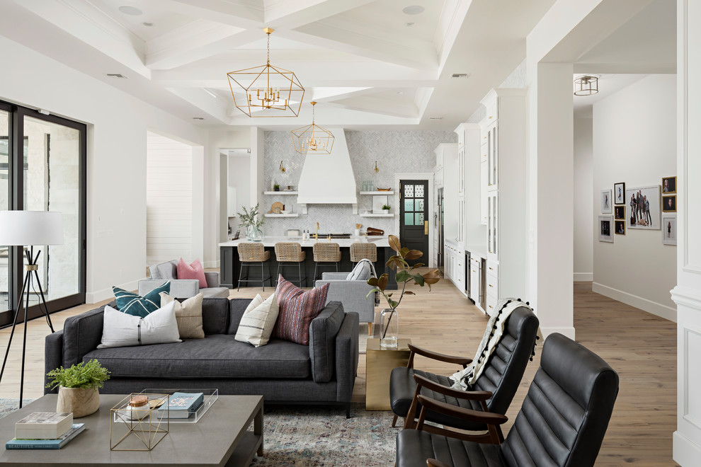 Huge transitional galley light wood floor and beige floor open concept kitchen photo in Phoenix with an undermount sink, shaker cabinets, white cabinets, quartz countertops, gray backsplash, marble backsplash, stainless steel appliances and an island