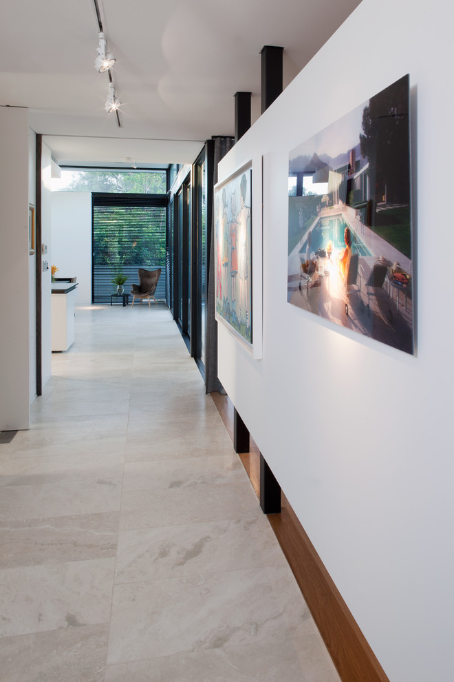 Photo of a contemporary hallway in Perth with white walls and travertine floors.