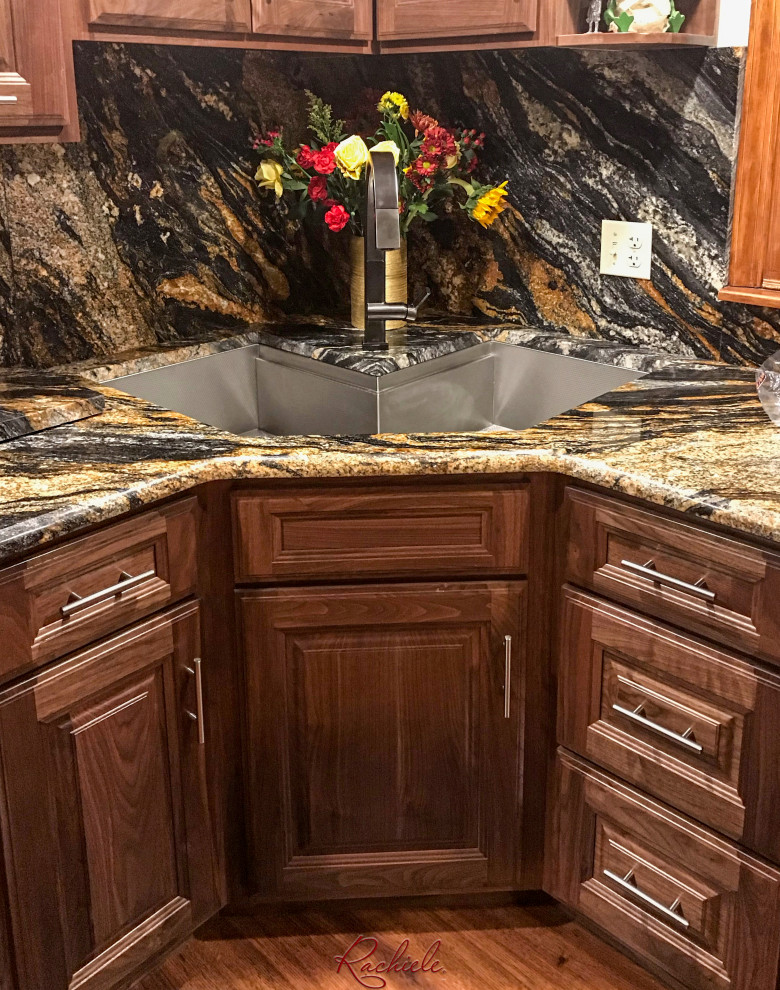 Enclosed kitchen - mid-sized traditional l-shaped medium tone wood floor and brown floor enclosed kitchen idea in Santa Barbara with a single-bowl sink, raised-panel cabinets, dark wood cabinets, granite countertops, multicolored backsplash, granite backsplash and multicolored countertops