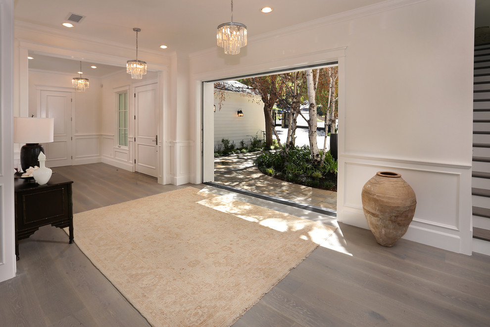 Design ideas for a large traditional entry hall in Los Angeles with white walls.