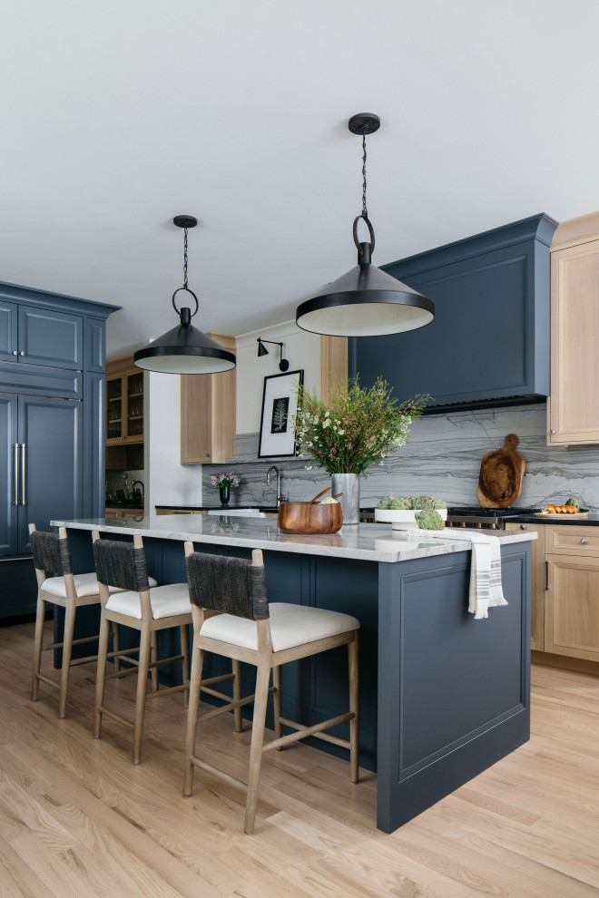 Inspiration for an open concept kitchen remodel in Denver with a farmhouse sink, recessed-panel cabinets, quartzite countertops, paneled appliances and an island