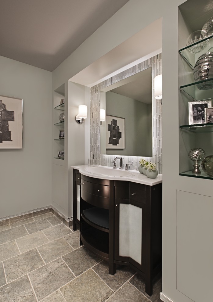 Design ideas for a mid-sized transitional bathroom in Detroit with furniture-like cabinets, dark wood cabinets, gray tile, matchstick tile, grey walls, slate floors, an undermount sink, solid surface benchtops and grey floor.