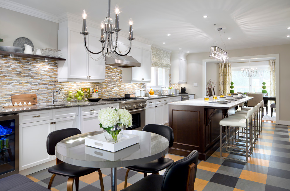 Photo of a traditional single-wall eat-in kitchen in San Francisco with yellow splashback, mosaic tile splashback and stainless steel appliances.