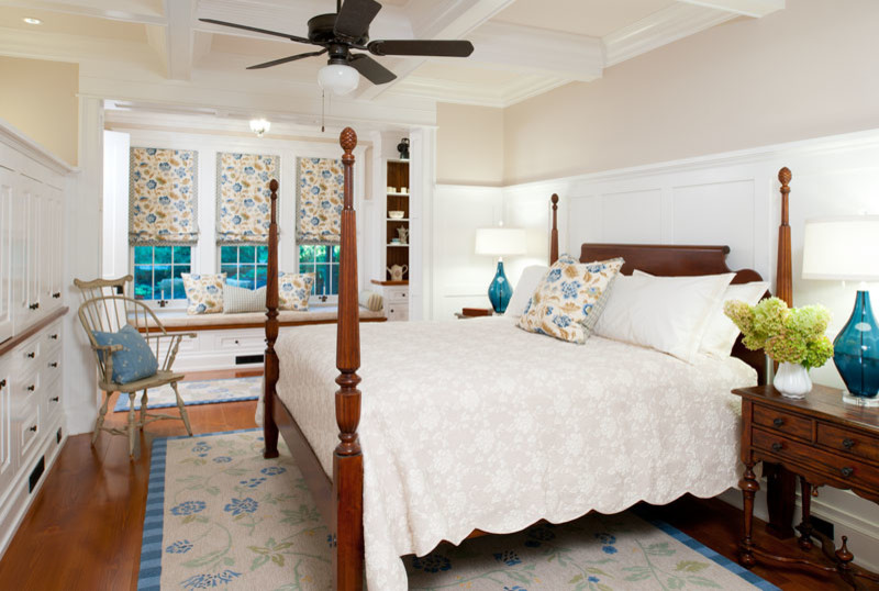 This is an example of a large country master bedroom in Other.