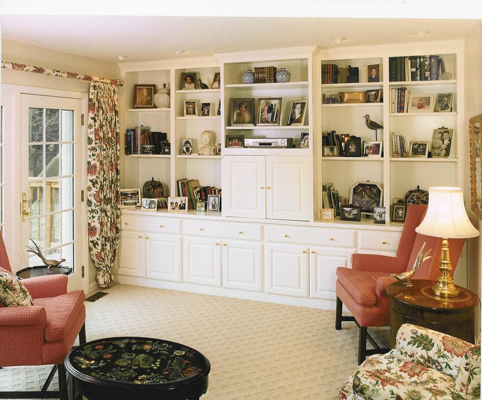 Inspiration for a mid-sized traditional enclosed family room in Detroit with white walls, carpet and no fireplace.