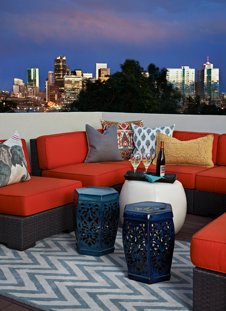 This is an example of an eclectic rooftop and rooftop deck in Denver with no cover.