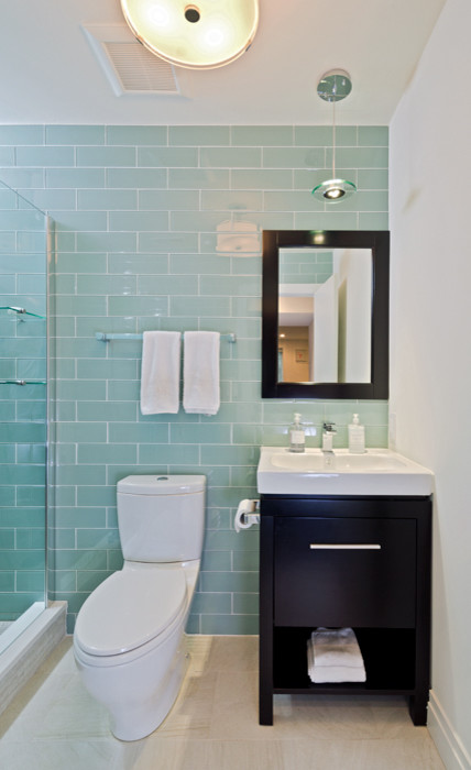 This is an example of a mid-sized transitional bathroom in DC Metro with furniture-like cabinets, dark wood cabinets, an alcove shower, a two-piece toilet, blue walls, ceramic floors, an integrated sink and engineered quartz benchtops.