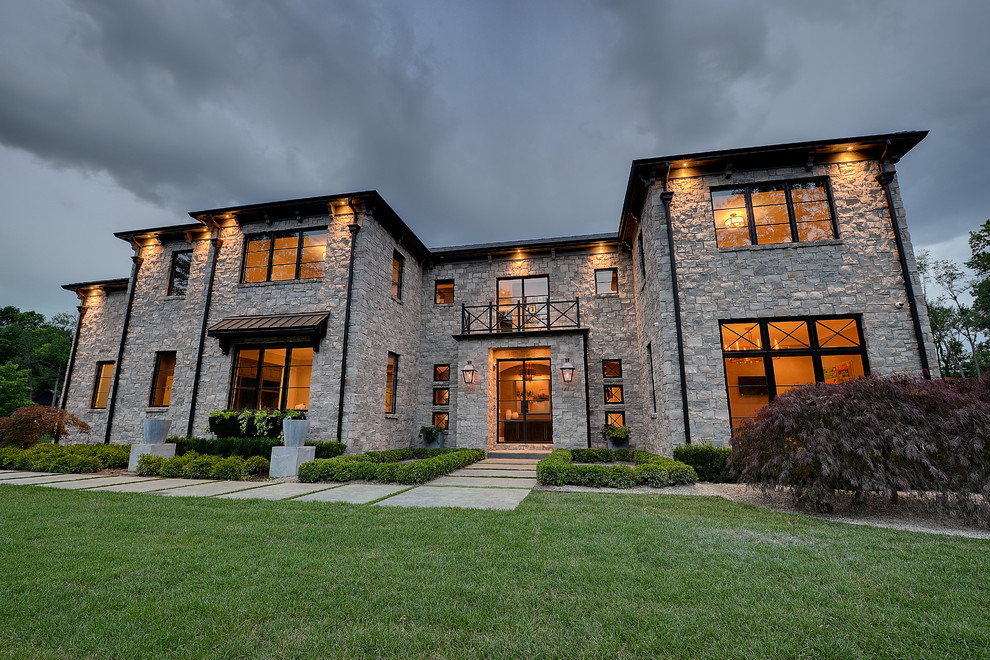 Expansive contemporary three-storey multi-coloured house exterior in Indianapolis with stone veneer.