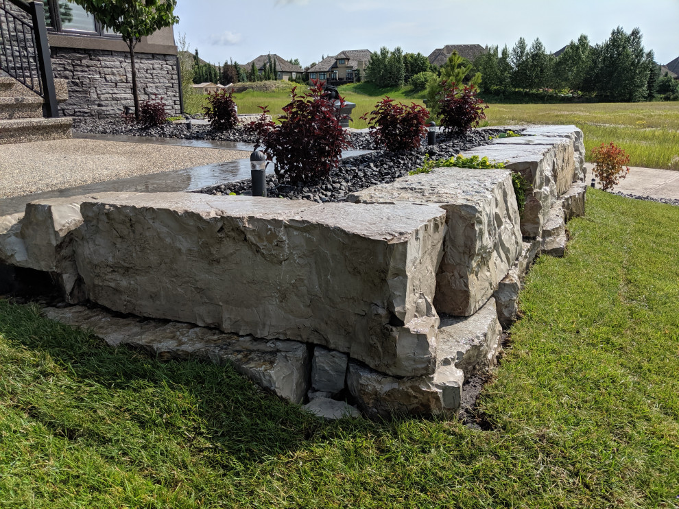 Linear patio and Armour stone retaining wall we built in Edmonton