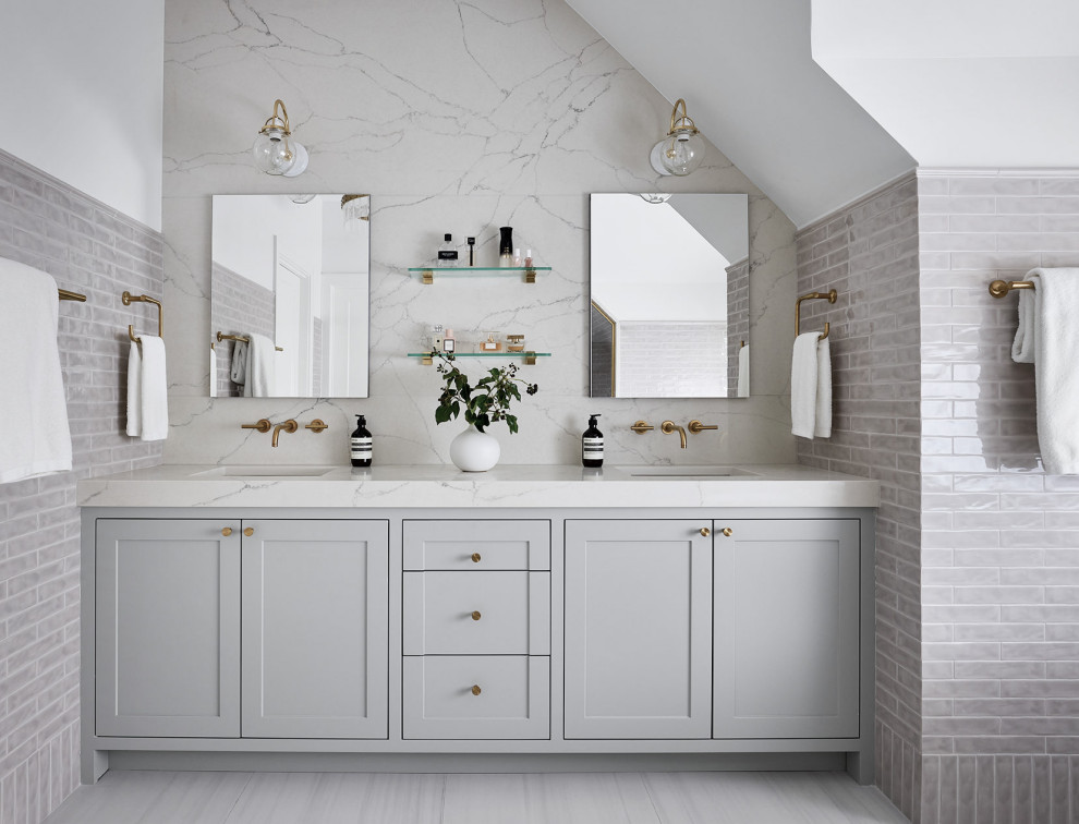 Example of a large transitional master gray tile and ceramic tile porcelain tile, gray floor and double-sink bathroom design in Chicago with shaker cabinets, gray cabinets, white walls, quartz countertops, a hinged shower door, white countertops and a built-in vanity