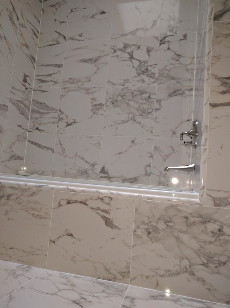 Alcove bathtub - mid-sized transitional master gray tile marble floor alcove bathtub idea in DC Metro with furniture-like cabinets, white cabinets, a wall-mount toilet, gray walls, an undermount sink and marble countertops