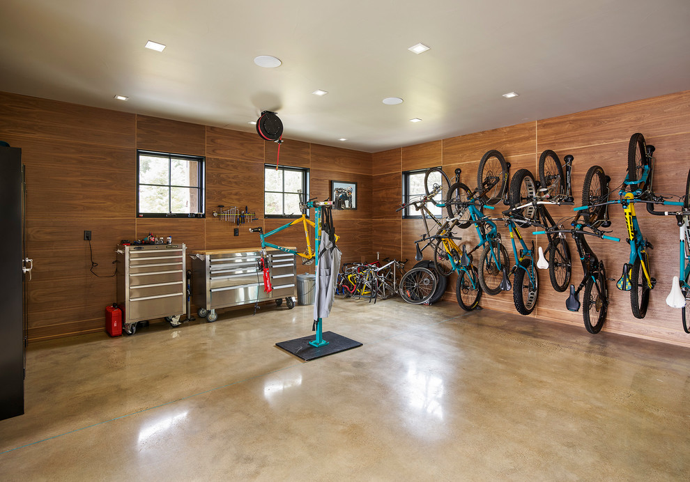 Garage workshop - large rustic detached garage workshop idea in Denver