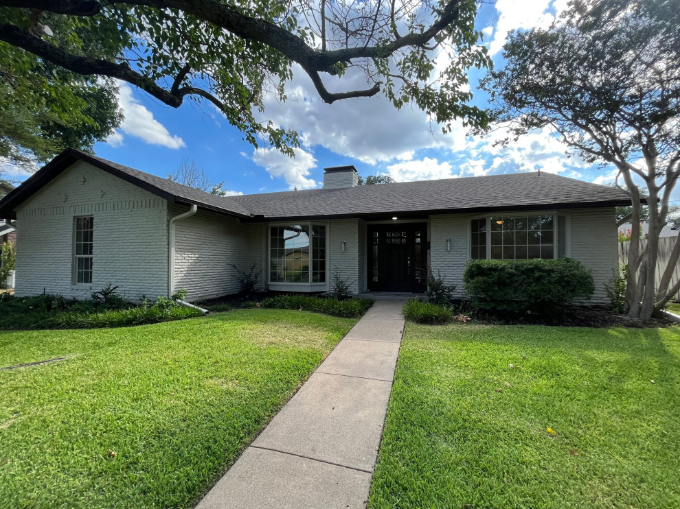 Mid-sized transitional beige one-story brick gable roof idea in Dallas with a shingle roof and a brown roof