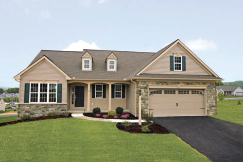 Example of a large classic two-story beige home design design