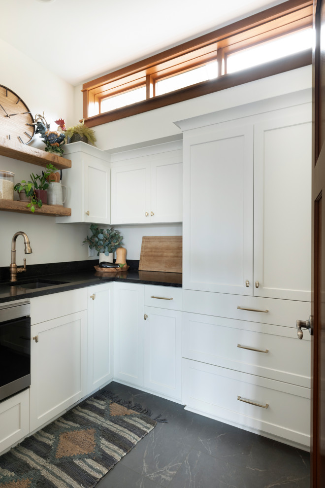 Design ideas for a transitional kitchen in Minneapolis with white cabinets.