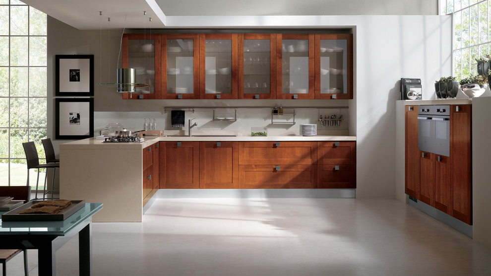 Large modern u-shaped eat-in kitchen in Melbourne with a double-bowl sink, raised-panel cabinets, brown cabinets, quartz benchtops, black appliances, porcelain floors and multiple islands.