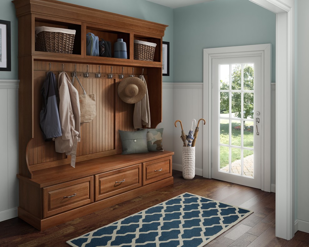 Mid-sized traditional mudroom in Other with blue walls, medium hardwood floors, a single front door, a glass front door and brown floor.