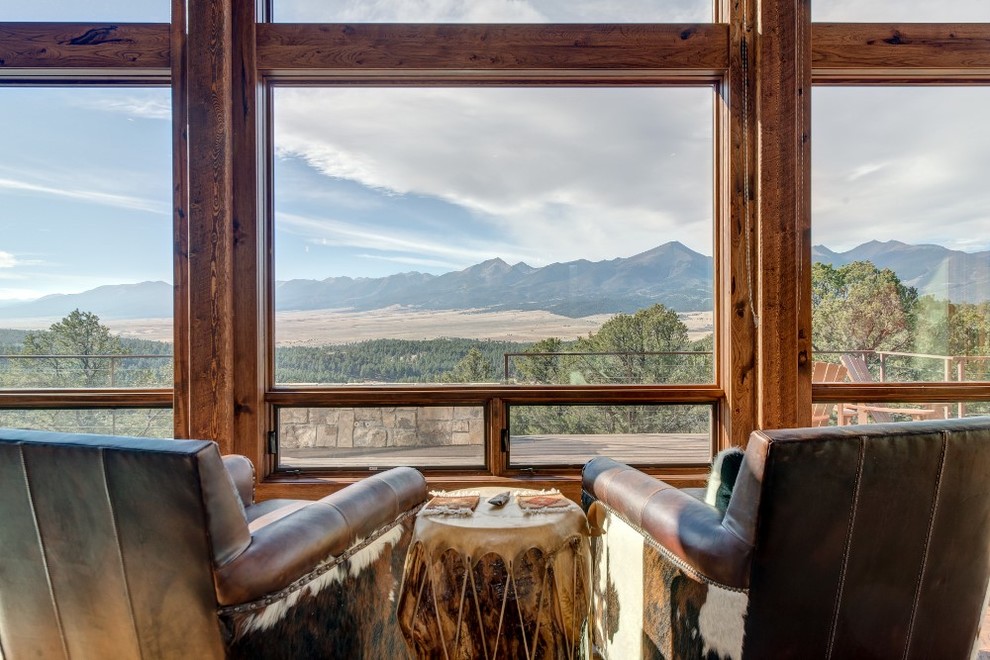 Example of a mountain style home design design in Denver