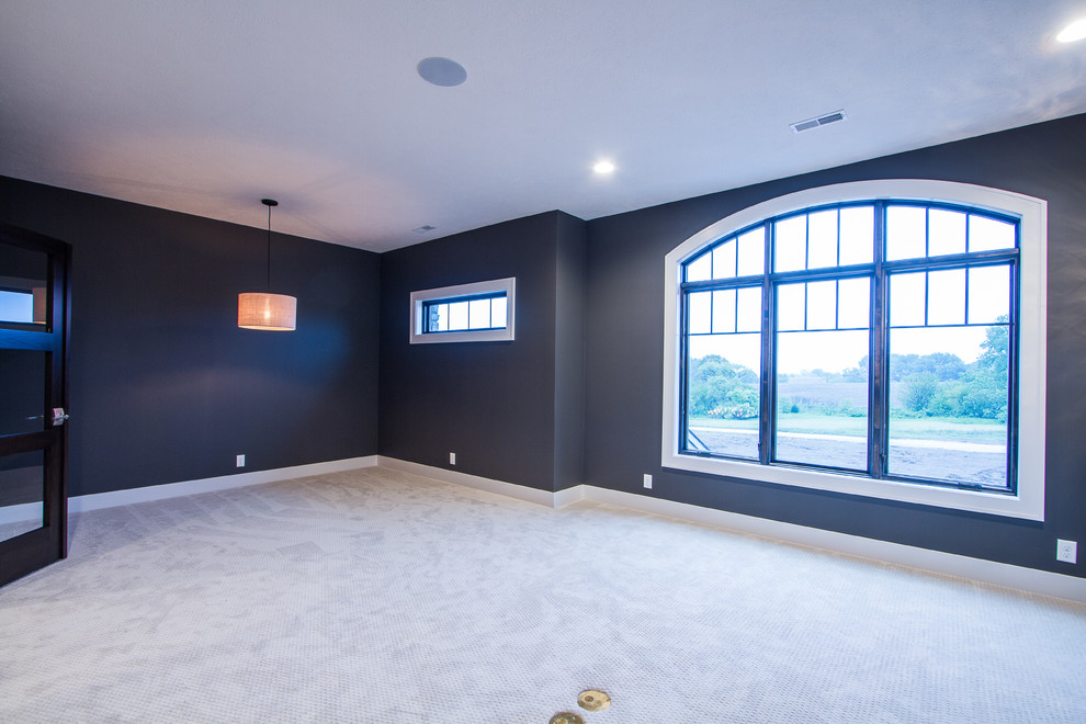 Large transitional study room in Omaha with grey walls, carpet, no fireplace and a built-in desk.