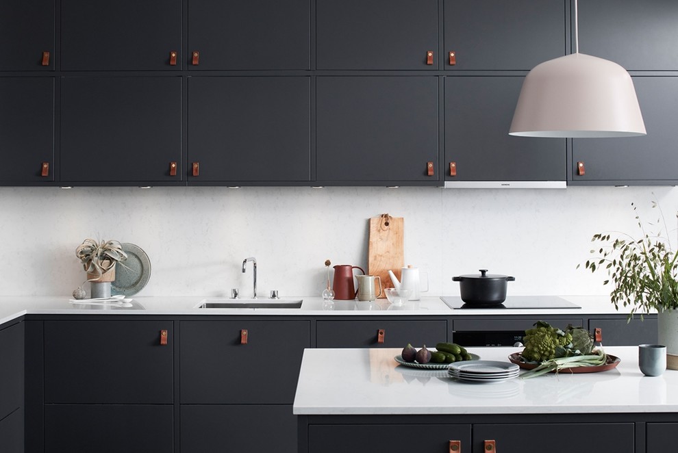 Inspiration for a modern kitchen in Gothenburg with black cabinets and with island.