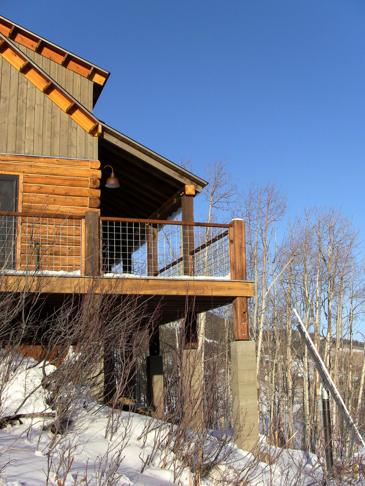 Example of a mountain style home design design in Denver