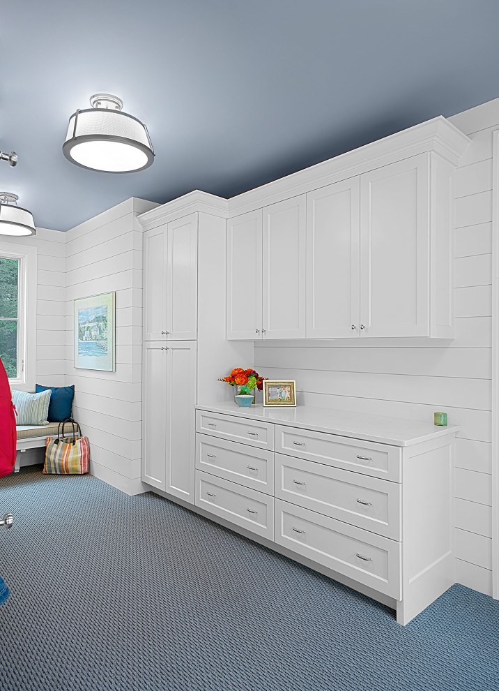 Large traditional mudroom in Grand Rapids with white walls, carpet, blue floor and planked wall panelling.