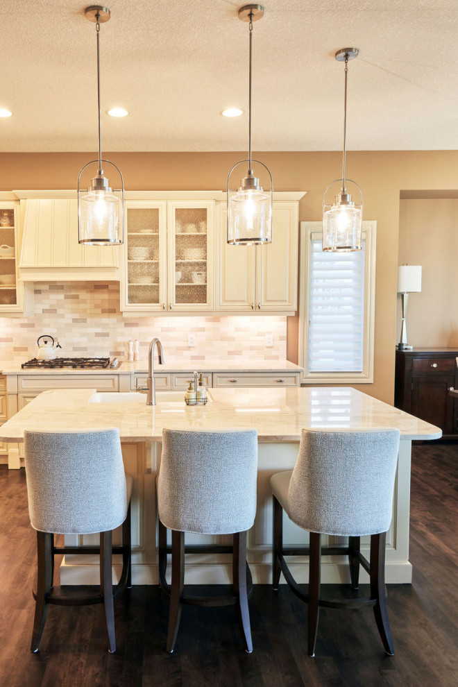 Example of a transitional kitchen design in Calgary