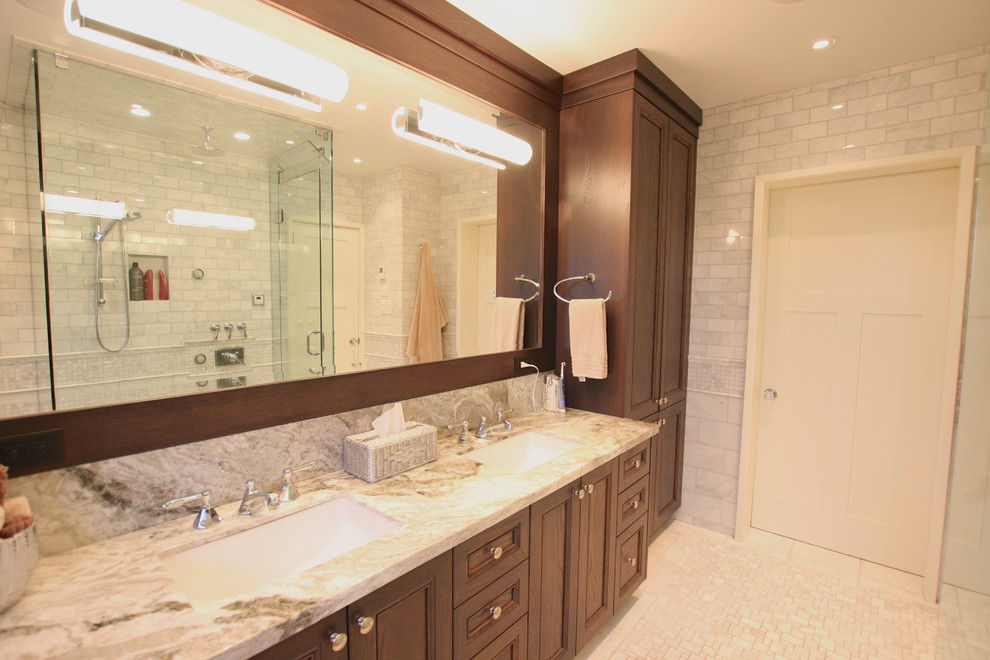 Large traditional master bathroom in Vancouver with an undermount sink, shaker cabinets, dark wood cabinets, granite benchtops, a one-piece toilet, white tile, stone tile, grey walls and marble floors.