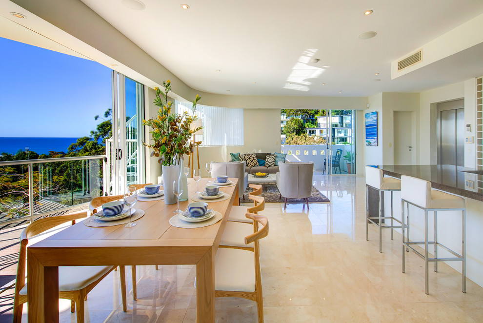 Inspiration for a contemporary open plan dining in Sunshine Coast with white walls.