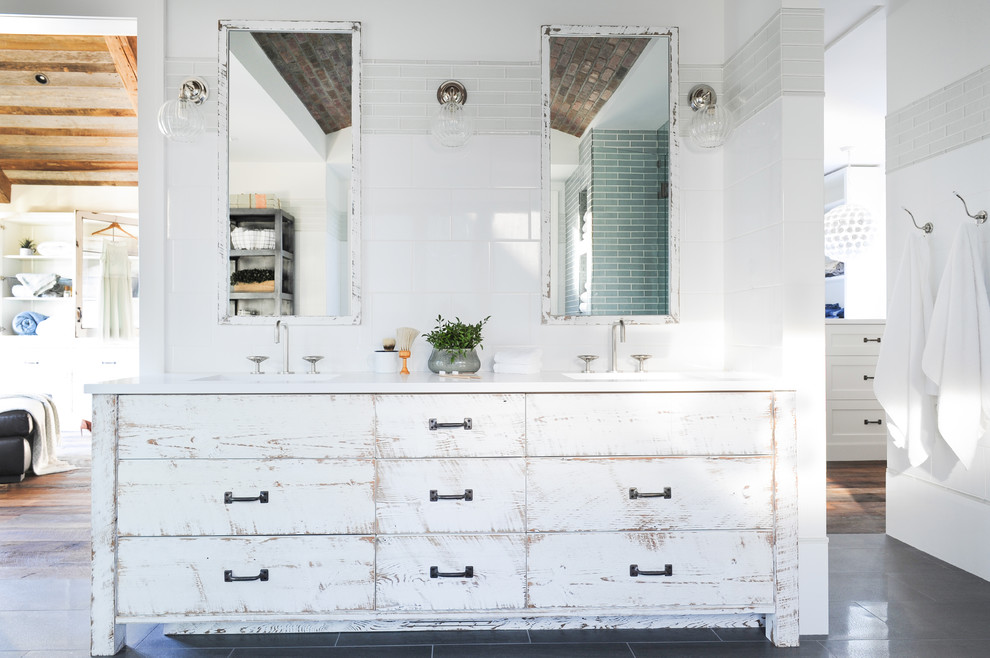 Photo of a large country master bathroom in Vancouver with flat-panel cabinets, a double shower, glass sheet wall, white walls, an undermount sink, marble benchtops, an open shower, ceramic floors, grey floor, distressed cabinets, white tile and white benchtops.