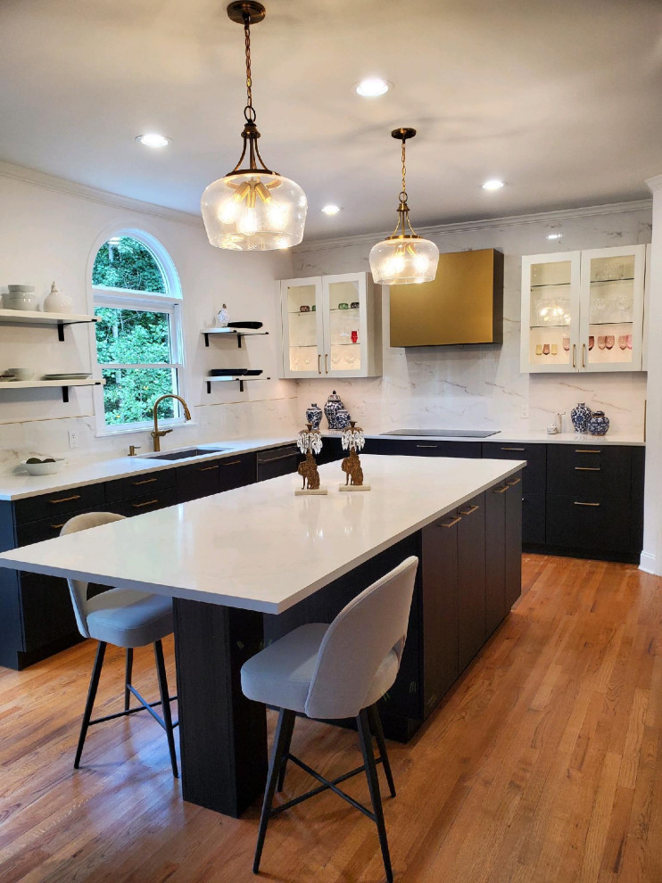 Inspiration for a mid-sized country u-shaped eat-in kitchen in Atlanta with a single-bowl sink, glass-front cabinets, black cabinets, quartz benchtops, white splashback, stone tile splashback, stainless steel appliances, light hardwood floors, with island, multi-coloured floor, white benchtop and coffered.