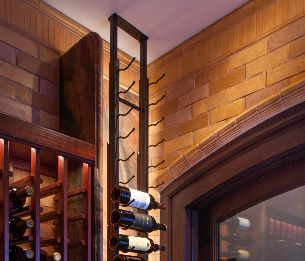 Design ideas for a large mediterranean wine cellar in San Diego with terra-cotta floors, display racks and red floor.