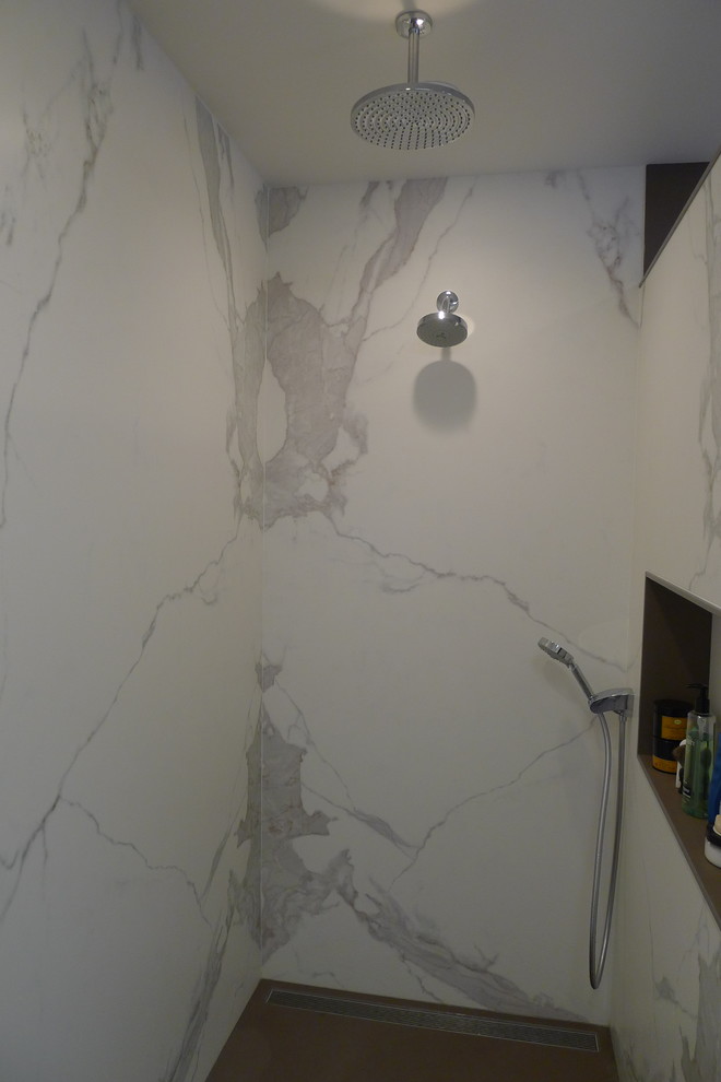 Large transitional master gray tile and porcelain tile porcelain tile home design photo in Indianapolis with a drop-in sink, furniture-like cabinets, dark wood cabinets, solid surface countertops, a one-piece toilet and gray walls