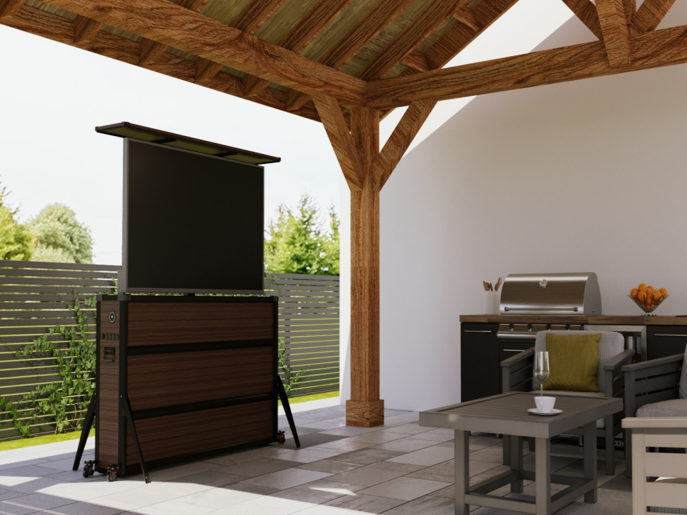 Covered patio outdoor kitchen with hidden TV lift cabinet