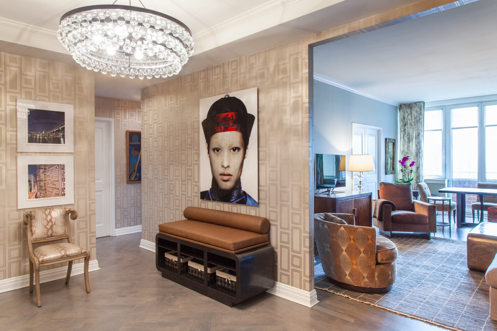 Mid-sized trendy medium tone wood floor and brown floor foyer photo in New York with gray walls