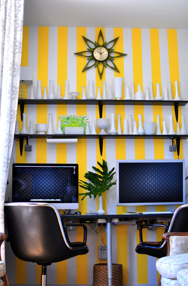 This is an example of an eclectic home office in Austin with multi-coloured walls.