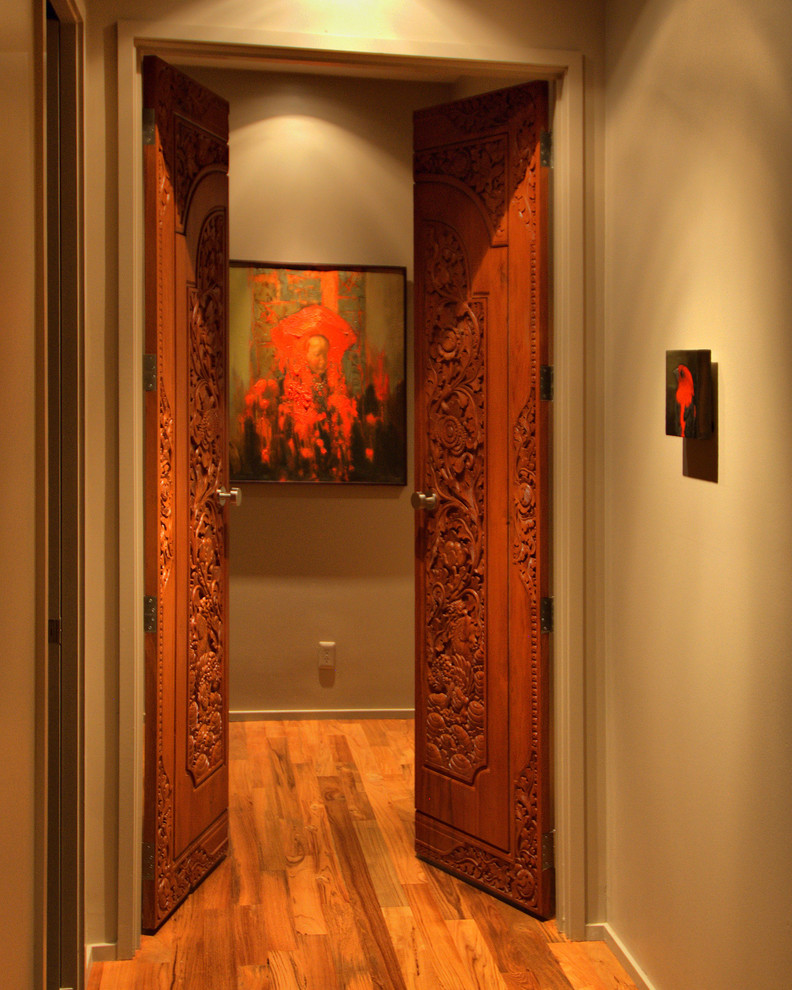 Traditional hallway in Portland with grey walls, medium hardwood floors and orange floor.