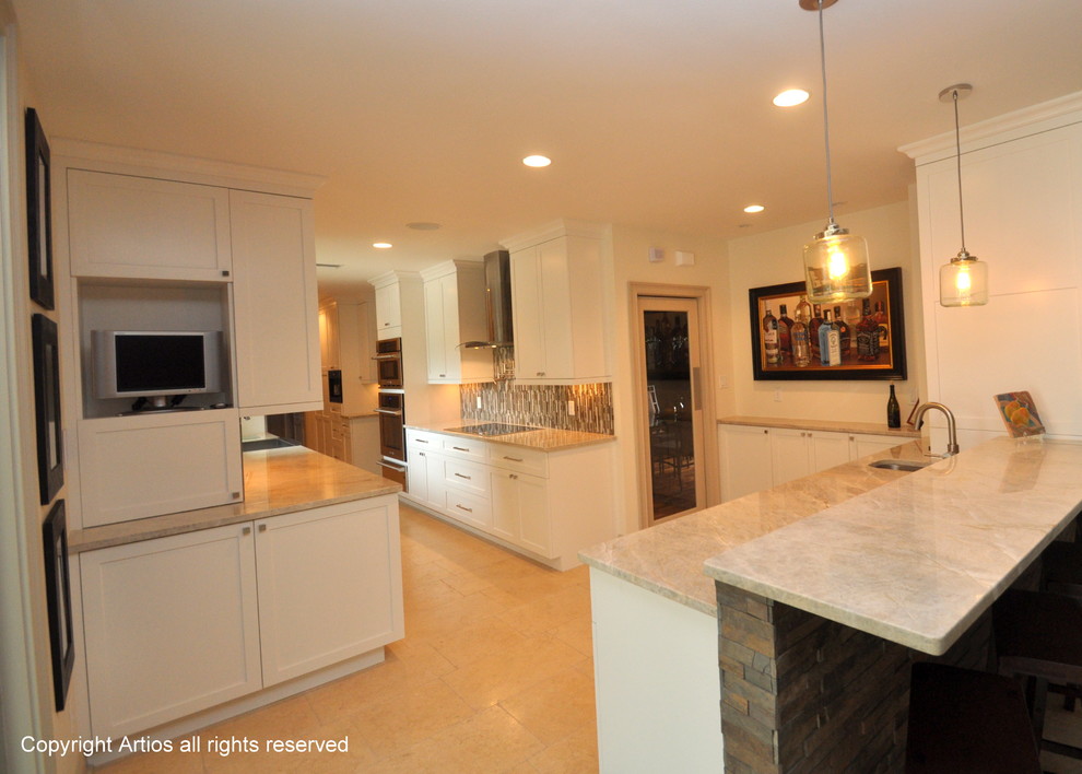 Example of a transitional galley eat-in kitchen design in Orlando with a farmhouse sink, shaker cabinets, white cabinets, granite countertops, multicolored backsplash and stainless steel appliances
