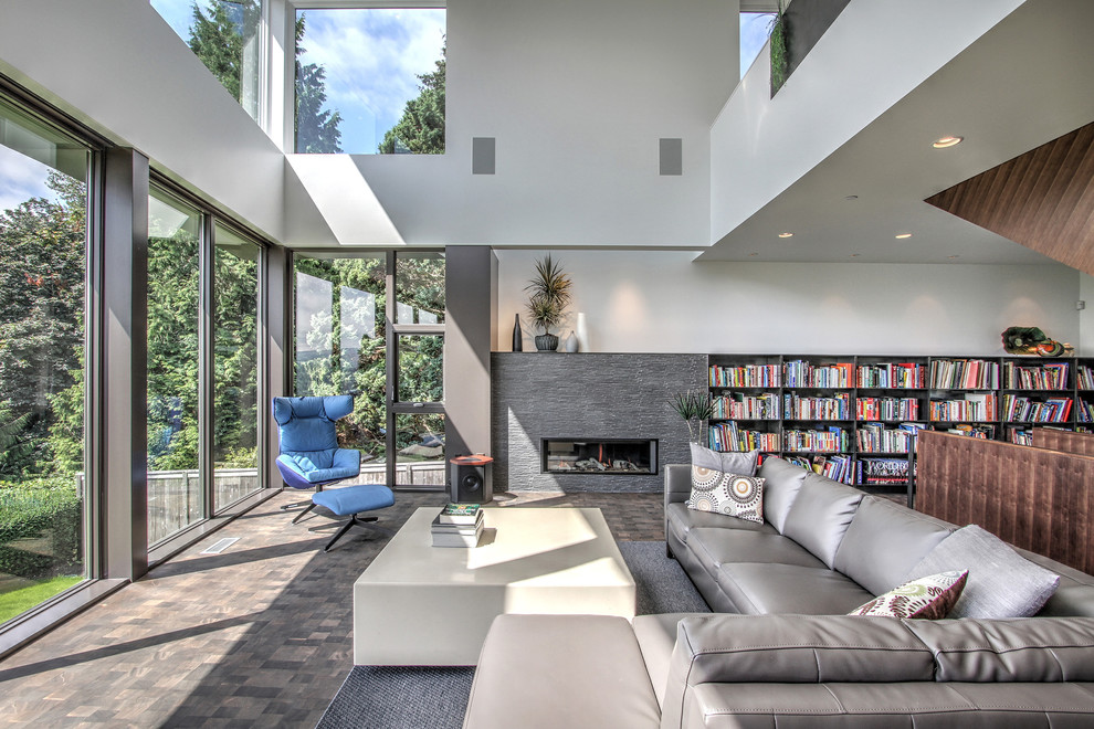 Inspiration for a large contemporary open concept living room in Seattle with a library, white walls, dark hardwood floors and a ribbon fireplace.