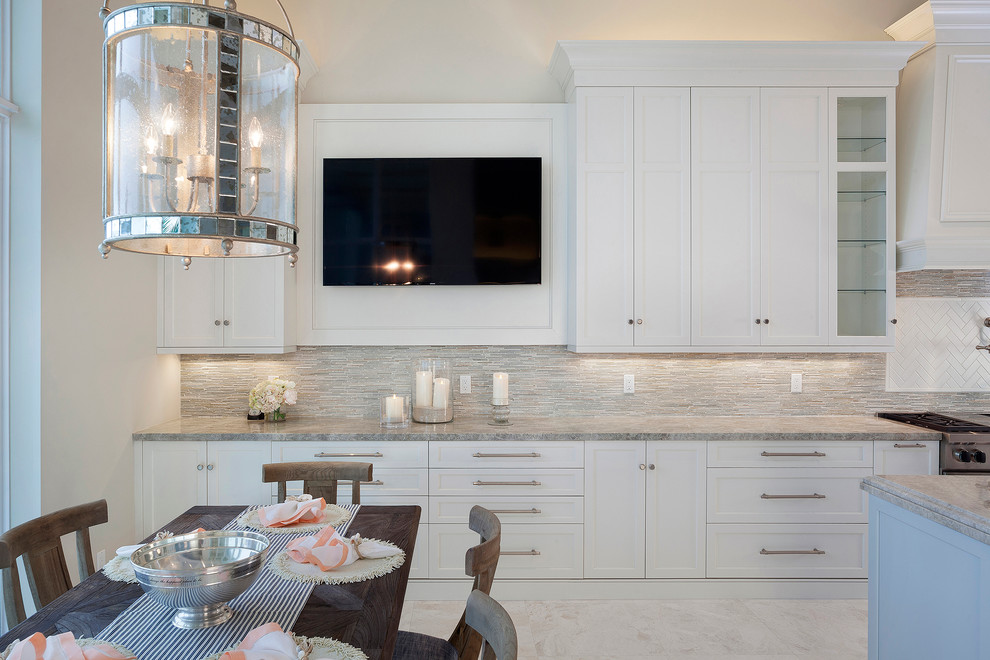 This is an example of a mid-sized transitional open plan dining in Miami with beige walls, marble floors, no fireplace and multi-coloured floor.